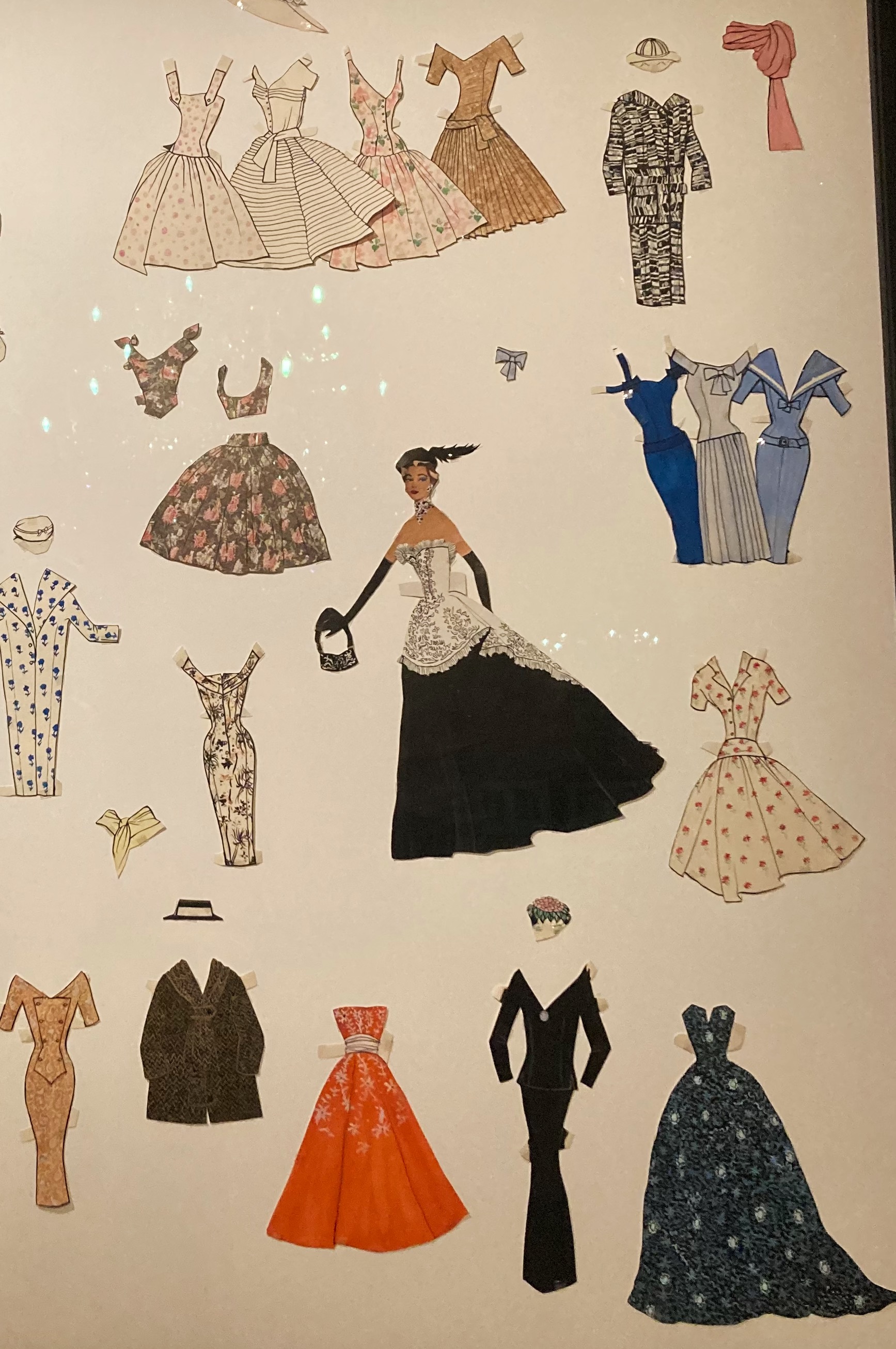 Paper dolls in a museum exhibition